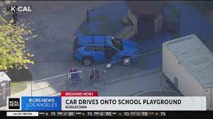 None Injured after car veers off road, ends up in elementary school playground